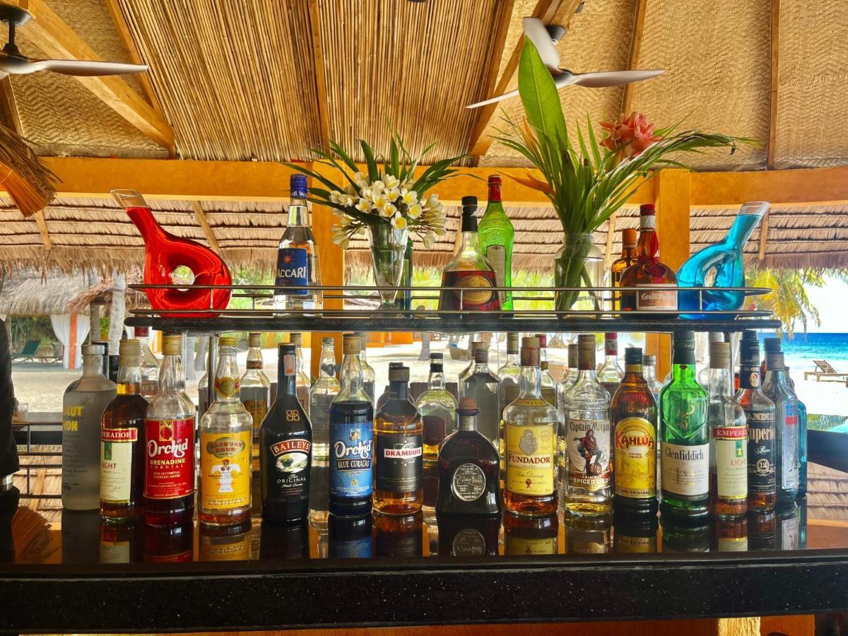 Coco Grove Beach Resort, Siquijor Island Ngoại thất bức ảnh Rum bottles at a bar in the Caribbean